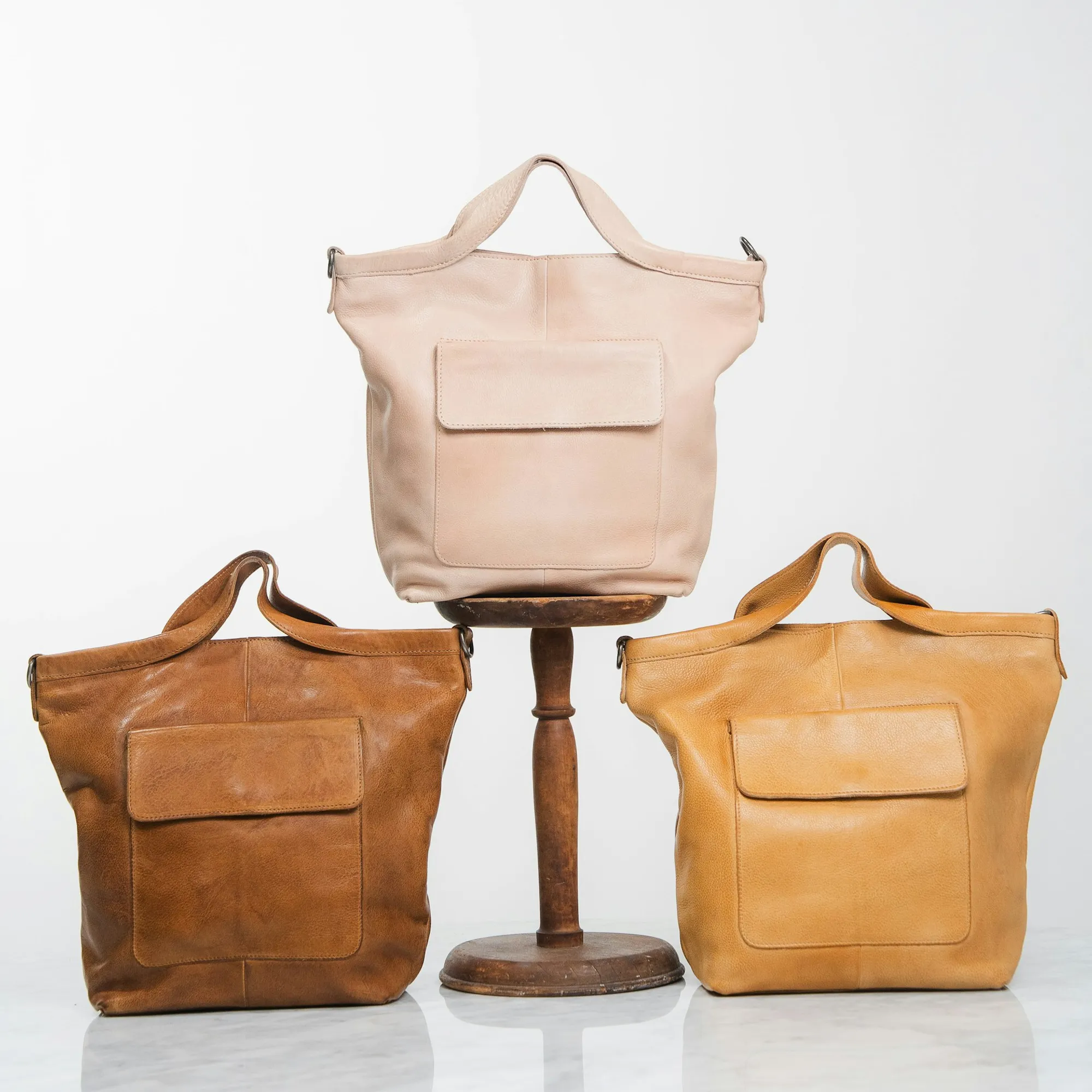 Group scene showcasing multiple women's bags, highlighting main product lines